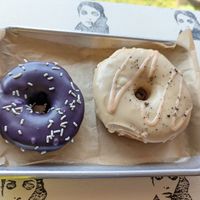 Ube vegan cake donut vs. non-vegan raised tiramisu donut, the raised one is definitely bigger! at Drift Dough in Rochester