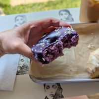 Ube donut "cross-section" via a couple of bites--it's purple on the inside, too! at Drift Dough in Rochester