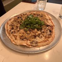 Pizza with mushrooms and truffle oil.  Good  at Community Restaurant in Oakville