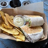 Vegan burrito w/ carrot bacon and cilantro mayo sauce; plantain chips on the side #Veganuary at Aguacate in Miami