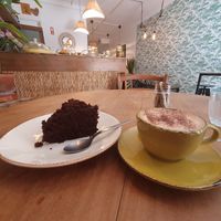 Coffee with oat Milk and cake at Cabane  in Lisbon