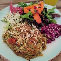 Vegan zucchini gratin with a plethora of salads 😍 at Cabane  in Lisbon