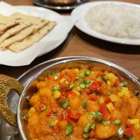 Chana masala, roti, rice, and aloo baingan dry curry. at Sapana in Hiroshima