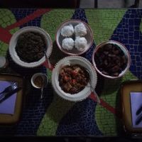 Tofu with greens, harricots with vegetable, fried plantains and steamed dumplings. Very interesting flavors! Delicious. at Djinkoume House in Dakar