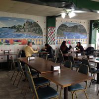 clever paintings on the seating area wall at Big Al's Healthy Foods in Tulsa