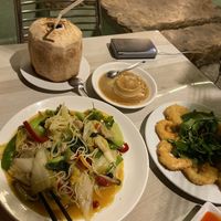 Fresh coconut, Japanese pudding, noodles with vegetables, fried vegan shrimps at BamBoo Vegan in Nha Trang