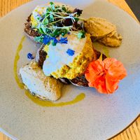 Roasted tomatoes on toast with chickpea scramble. Delicious!!! at Alberta's in Mapua