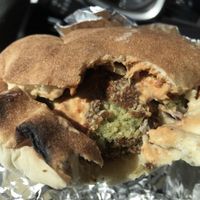 Falafel pita w hummus, baba ganoush, harissa, tahini, purple cabbage and onions   at Naf Naf Grill in Eagan