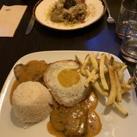 Bitoque: seitan steak with mustard-y sauce, very oily egg, fries and rice  at Kong - Food Made With Compassion in Lisbon