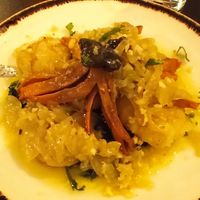 "Octopus" with potatoes, caramelized onions and spinach at Kong - Food Made With Compassion in Lisbon