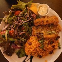 Fish with rice and beans and salad at Kong - Food Made With Compassion in Lisbon