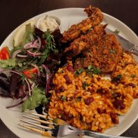 Peixe com arroz, tomate e feijão. Já comido um pouco porque estava mto bom! at Kong - Food Made With Compassion in Lisbon