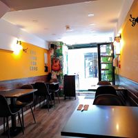 Tables near the entrance at Kong - Food Made With Compassion in Lisbon