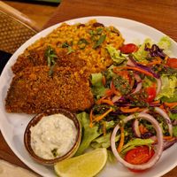 Fish with tomato and bean ricee  at Kong - Food Made With Compassion in Lisbon