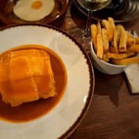 Francesinha que viene también con las patatas. at Kong - Food Made With Compassion in Lisbon