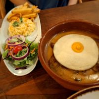 Bitoque, acompañado de ensalada, arroz y patatas. Deliciosas la salsa con toque a mostaza. at Kong - Food Made With Compassion in Lisbon