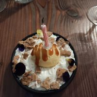 Dessert with birthday candle at Kong - Food Made With Compassion in Lisbon