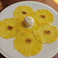 Pineapple Carpaccio with lime zest and coconut ice cream at Kong - Food Made With Compassion in Lisbon