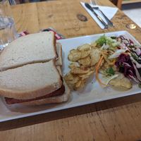 Stale bread sausage sandwich and salad - not worth £7.50! at Cafe Royal in Leamington Spa