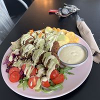 Falafel Plate (Falafel, Hummus, Carrot fries, Baked potatoes, red cabbage, rocket, tomatoes)  at Tavci Kuhna in Lesce