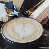 Lemon cheesecake (GF), jaffa cake and coffee with oat mylk at Tavci Kuhna in Lesce