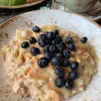 Peanut butter porridge with bananas and blueberries - perfect 🤩   at Cafe Drechsler in Vienna