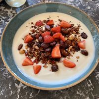 Vegan yogurt with granola and strawberries 🍓  at Cafe Drechsler in Vienna