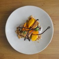 Almond rum cake, chestnut cream, persimmon, orange gel, chocolate 70% at Arkhe in Lisbon