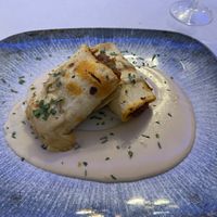 Talo relleno de verduras con chorizo vegano y salsa de queso.  at La Parada de Bilbao in Bilbao