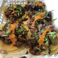 Bomb jackfruit tacos on a taco Tuesday where you get one free.  at Just Vegana in Fontana