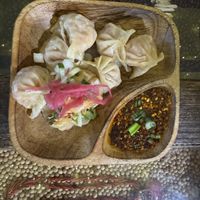 Vegan Spinach Mushroom Tofu dumplings with hot chili oil  at Sula Wok in Ottawa