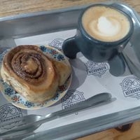 Cinnamon roll with cappuccino for 58 reais. ;) at Astronauta in Sao Paulo
