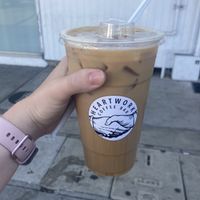 An oat milk latte with their house made lavender syrup  at Heartwork Coffee Bar in San Diego