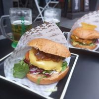Vegan burger with caramalized onion and cheese and one mexican burger in back with Beyond burger at H Burger in Gran Canaria