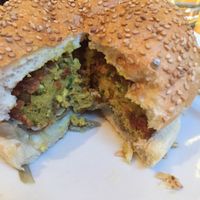 Inside the bun: chickpea, quinoa and lentil pattie, chickpea and mint hummus, sautéed artichokes and vegan mayo  at Open Baladin in Rome