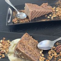 Chocolate cake on the top and carrot cake on the bottom! Very tasty!!! (The chocolate one was made with no nuts and has a very rich coaco flavor)  at El Punto Vegano in Catano