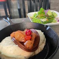 Vegan ham and pineapple over mashed potatoes at El Punto Vegano in Catano