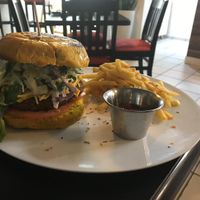 Quinoa burger with pumpkin buns and fries at El Punto Vegano in Catano