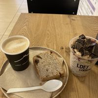 Vegan deal. Oat milk cappuccino, coconut bread and Sexy Strawberry overnight oats at YB by Yoghurt Barn - Central in Amsterdam