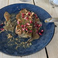 Smoked garlic miso aubergine small plate, part eaten  at The Roundhill in Brighton