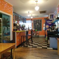 Cute, small place with some seating and nice artwork at Jo Mama's in Orleans