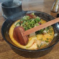 Ramen noodles with tofu and fresh vegetables, jasmine tee in the background at Feel Seoul Good in Berlin