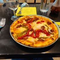 My pizza based tomato, with red and green pepper, onion, mock meat, and finally mozzarella.
Godd point on the chlli pepper sauce, that is hot hot hot!  at Happiz - Monge in Paris