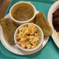Gravy, garlic bread, and carrot salad  at Dharma's in Capitola