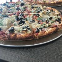 Vegan marinara, olive, artichoke, olive pizza....special is 2 large 3 topping for 23.99, vegan cheese is $2 more. Yum! at Pizza Twist in Clovis