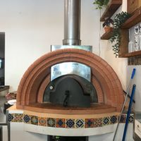 wood fire pizza oven that makes THE best pizzas  at Golden Grapes in Glebe