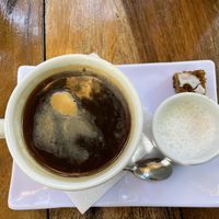 Americano with oat milk and bite of vegan friendly carrot cakee  at Elephant Garden in Puerto Escondido