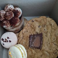 Two macarons, tiramisu and giant chocolate-chip cookie at Pastel & Coco in Gatineau