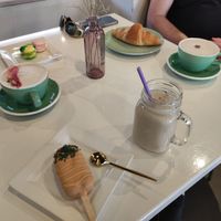 Lollipop carrot cake, croissant, macarons + moon mylk (center is an iced one, right is a hot one) and wild flowers drink. at Pastel & Coco in Gatineau