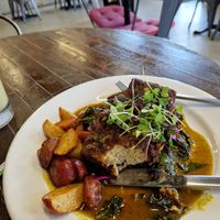 Southern Style Tofu. Crispy seasoned tofu, collard greens, baby Road potatoes, sweet garlic and ginger sauce at The Stand Vegan Cafe in Fairfield